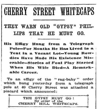 An illustration shows an effigy of a man hanging from a telegraph pole on Morgan Phillips's lot.
